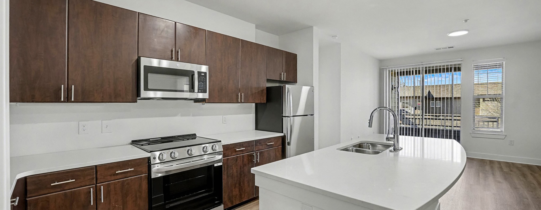 a kitchen with wooden cabinets