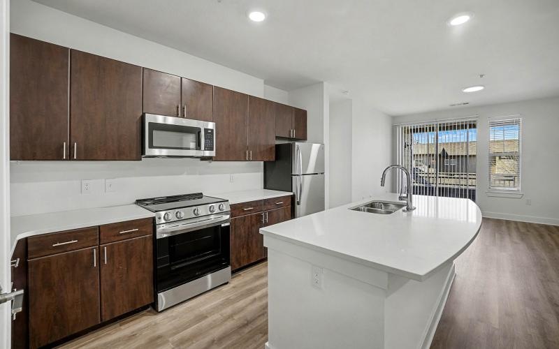 a kitchen with wooden cabinets