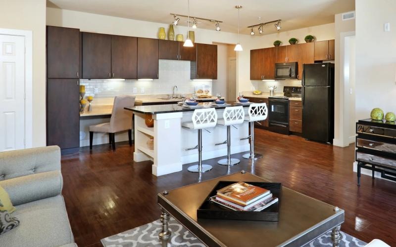 a kitchen with an island and a table